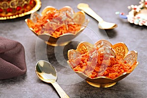 Indian Food Gajar ka Halwa Carrot Sweet Pudding in  Golden Bowls photo