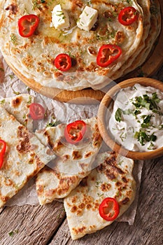 Indian food: hot paratha stuffed with potato close-up. vertical