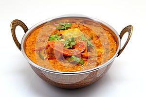 Indian Food or Indian Curry in a copper brass serving bowl