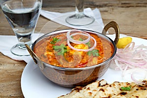 Indian Food or Indian Curry in a copper brass serving bowl