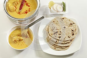 Indian Food: Kadhi with gatte and chapatti or roti. photo