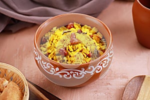 Indian Food Maharashtra Poha with Peanuts in a Pottery Bowl