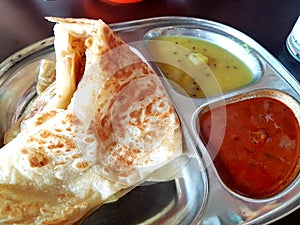 Indian food of Roti Paratha and curry dipping