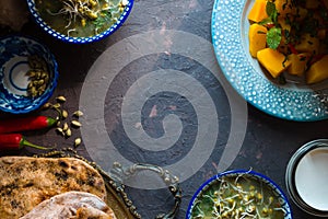 Indian food still life on the dark background top view