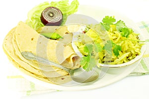 Indian food vegetable cabbage masala shaak dish with tortilla photo