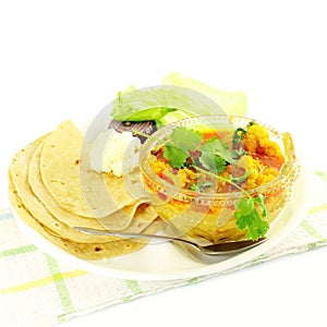 Indian food vegetable cauliflower masala shaak dish with tortilla photo