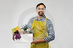 Indian gardener or farmer with box of garden tools