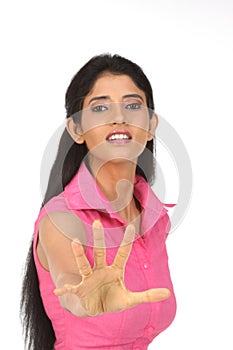 Indian girl avoiding with her hands