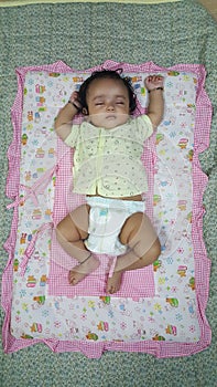 Little infant girl sleeping peaceful expression