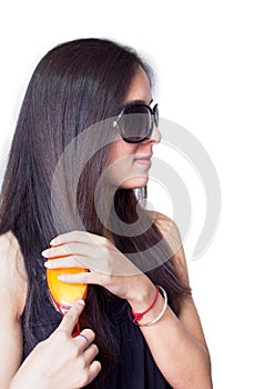 Indian girl combing her hairs.