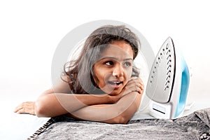 Indian girl and electric steam iron