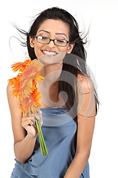 Indian girl with orange daisy flowers
