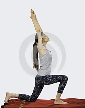 Indian girl performing surya namaskar yoga