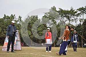 Indian girl play Javline in schol plyground