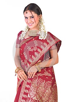 Indian girl in standing posture with rich jewelery photo