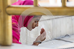 Indian girl visiting the Golden Temple in Amritsar, Punjab, India.