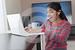 Indian girl working with laptop