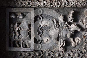 Indian gods Siva and Parvati on ceiling of 12th century temple Hoysaleswara with fantastic carvings