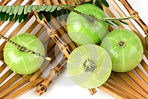 Indian Gooseberry or Phyllanthus emblica fruits isolated on white background