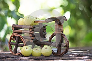 Indian Gooseberry or phyllanthus emblica fruits on nature background