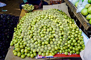 Indian gooseberry selling in market, Tasty and healthy indian gooseberry called AAMLA, Indian