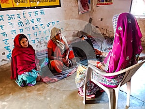 indian government school teacher giving training about laptop computer system at classroom in india January 2020