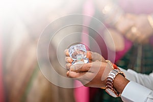 Indian groom offering wedding ring. Marriage proposal