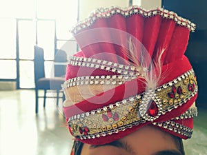 Indian groom`s turban with kilangi. Traditional Rajasthani turban.