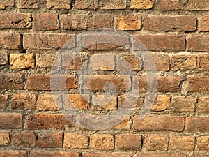 Indian Grunge brick wall texture for your background.Old red brick wall texture background in sunlight.Detailed old red brick wall