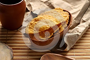 Indian Gujarati Food Fafda in a Clay Bowl on Paper and Wood photo