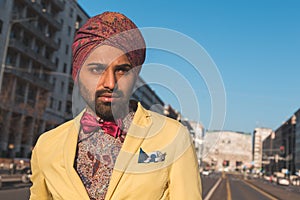 Indian handsome man posing in an urban context