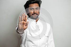 Indian handsome man showing `no` gesture