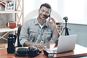 Indian Happy Young Man Photographer Work from Home