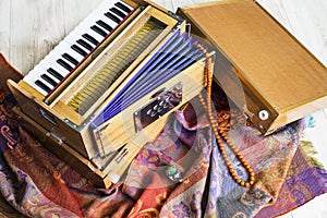 Indian harmonium, a traditional wooden keyboard instrument, close-up photo