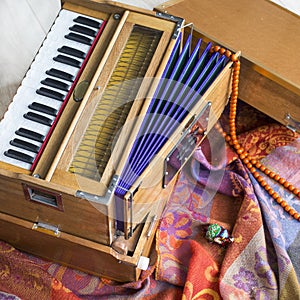 Indian harmonium, a traditional wooden keyboard instrument, close-up photo