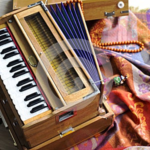 Indian harmonium, a traditional wooden keyboard instrument, close-up photo