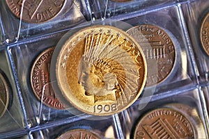 Numismatic at work shows some gold coins. photo