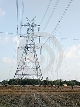 Indian high voltage electricity transmission system conductor placing on the tower