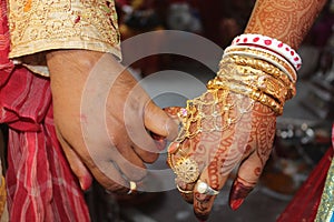 Indian Hindu Couple holding each other hands during their marriage