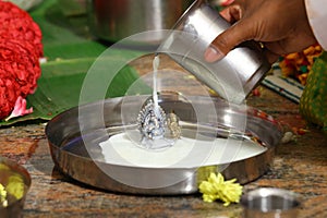 Indian Hindu God Ganesh Pooja, Milk Abhisheka, photo