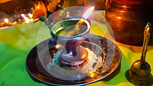 In The Indian Hindu Worship, At Night Time, Diya Lamp Burning Front Of Lord