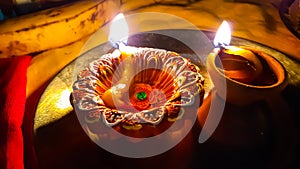 In The Indian Hindu Worship, At Night Time, Diya Lamp Burning Front Of Lord. Retuls