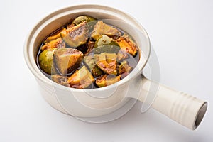 Indian Homemade Raw Mango Pickle or aam ka achar or Kairi Loncha in a bowl