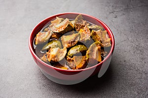 Indian Homemade Raw Mango Pickle or aam ka achar or Kairi Loncha in a bowl