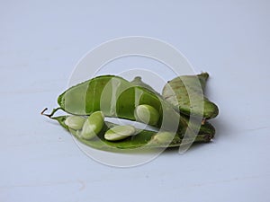 Indian Hyacinth Beans or Avarekai with and without peeled seeds  on white background
