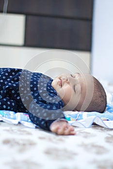 Indian Infant baby sleeping with toys