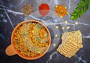 Hot and spicy instant masala atta noodles with spices and herbs photo