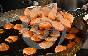Indian kachori being fried in sweet stall