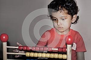 Indian kid playing Abacus