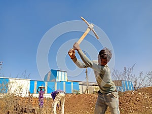 indian labour digging lime soil for construction work in India dec 2019